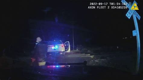 Colorado officer who put woman in police car hit by train didn’t know it was on the tracks, defense says